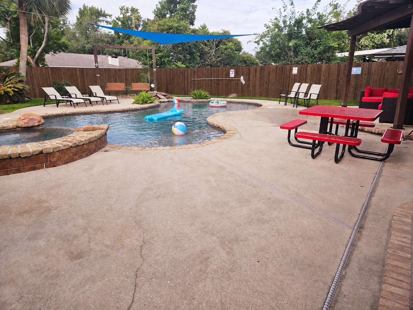 Private pool and outdoor seating at Poolside Retreat in Lake Charles